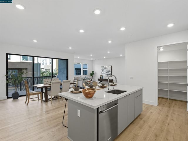 a view of living room with furniture and wooden floor