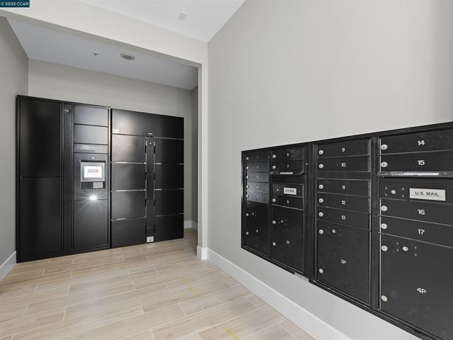 a view of a room with lots of furniture and windows