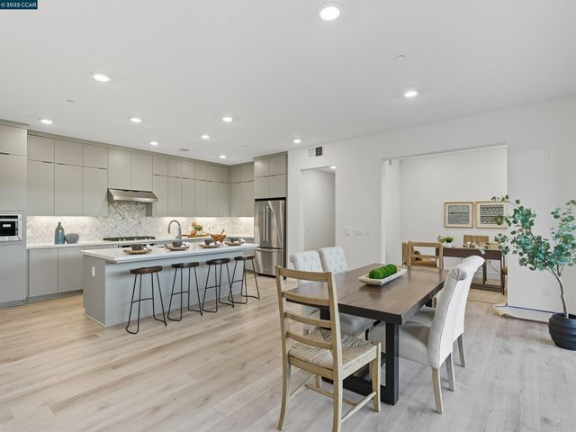 a kitchen with a table and chairs in it