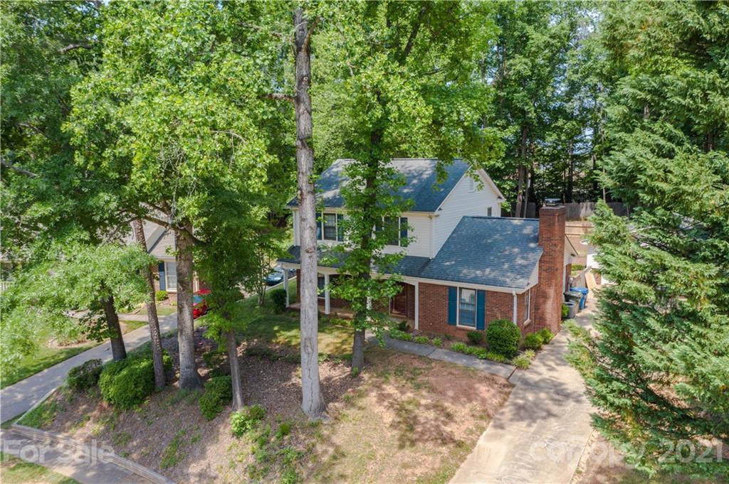 412 Neill Ridge Road Matthews, NC 28105 - Photo 1 of 25 a front view of a house with garden