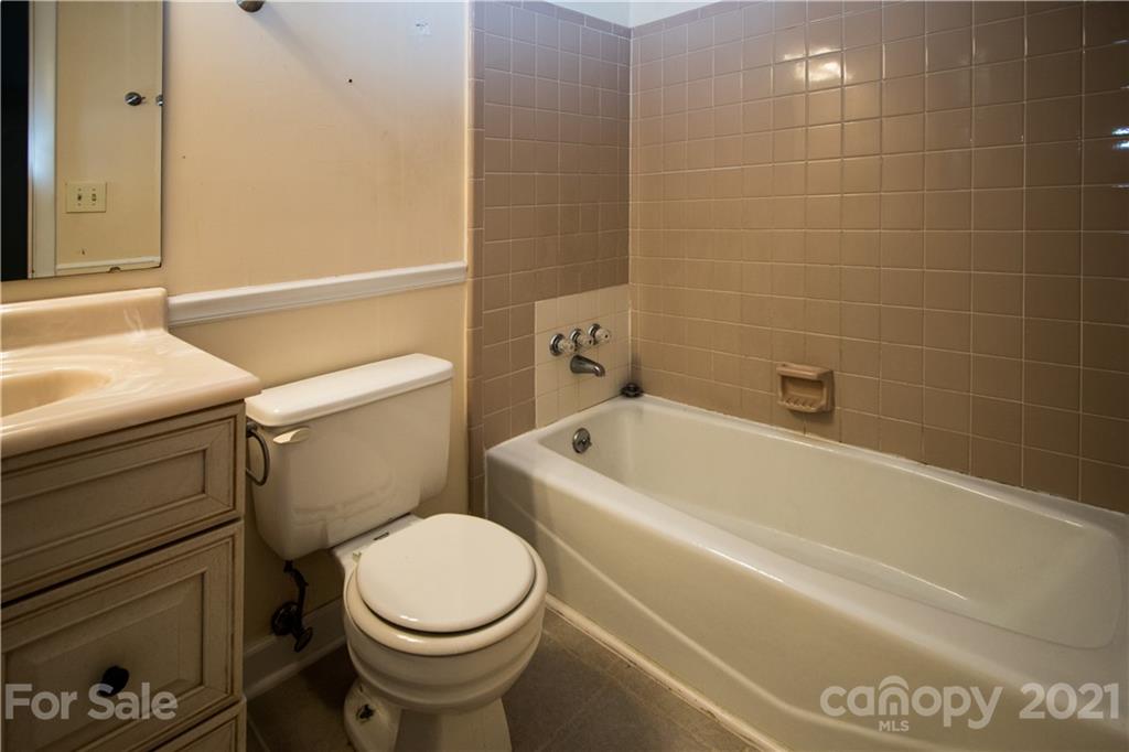 412 Neill Ridge Road Matthews, NC 28105 - Photo 20 of 25 a white toilet sitting next to a bath tub