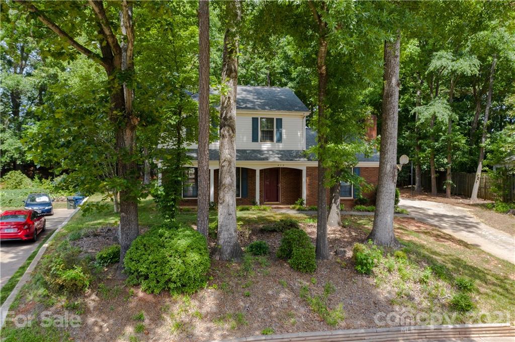 412 Neill Ridge Road Matthews, NC 28105 - Photo 3 of 25 a front view of a house with garden