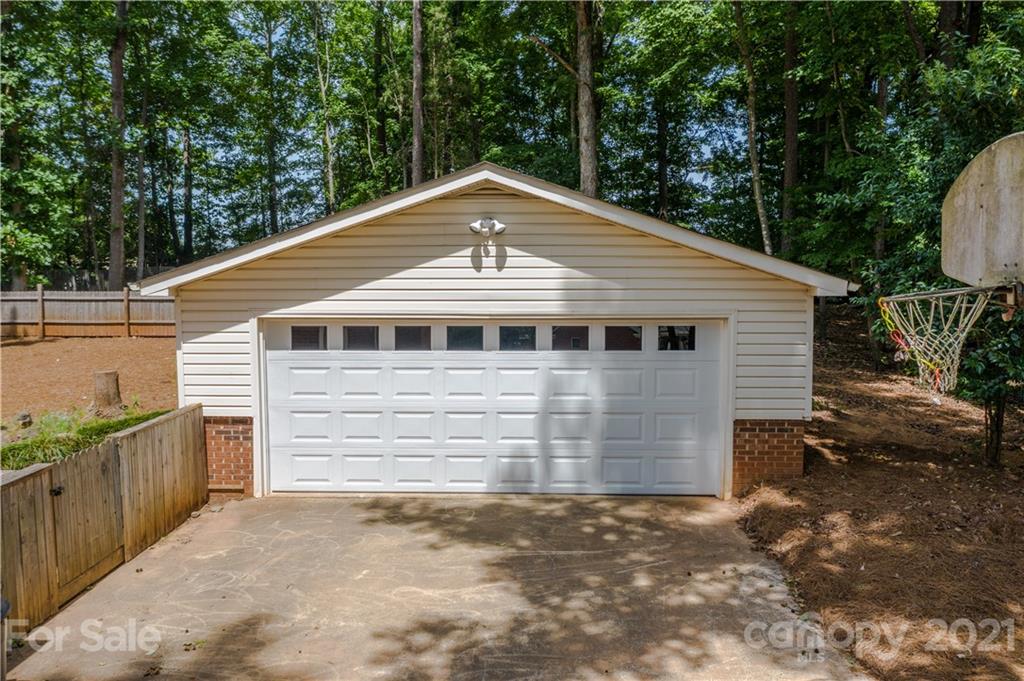 412 Neill Ridge Road Matthews, NC 28105 - Photo 25 of 25 a front view of a house with a garage