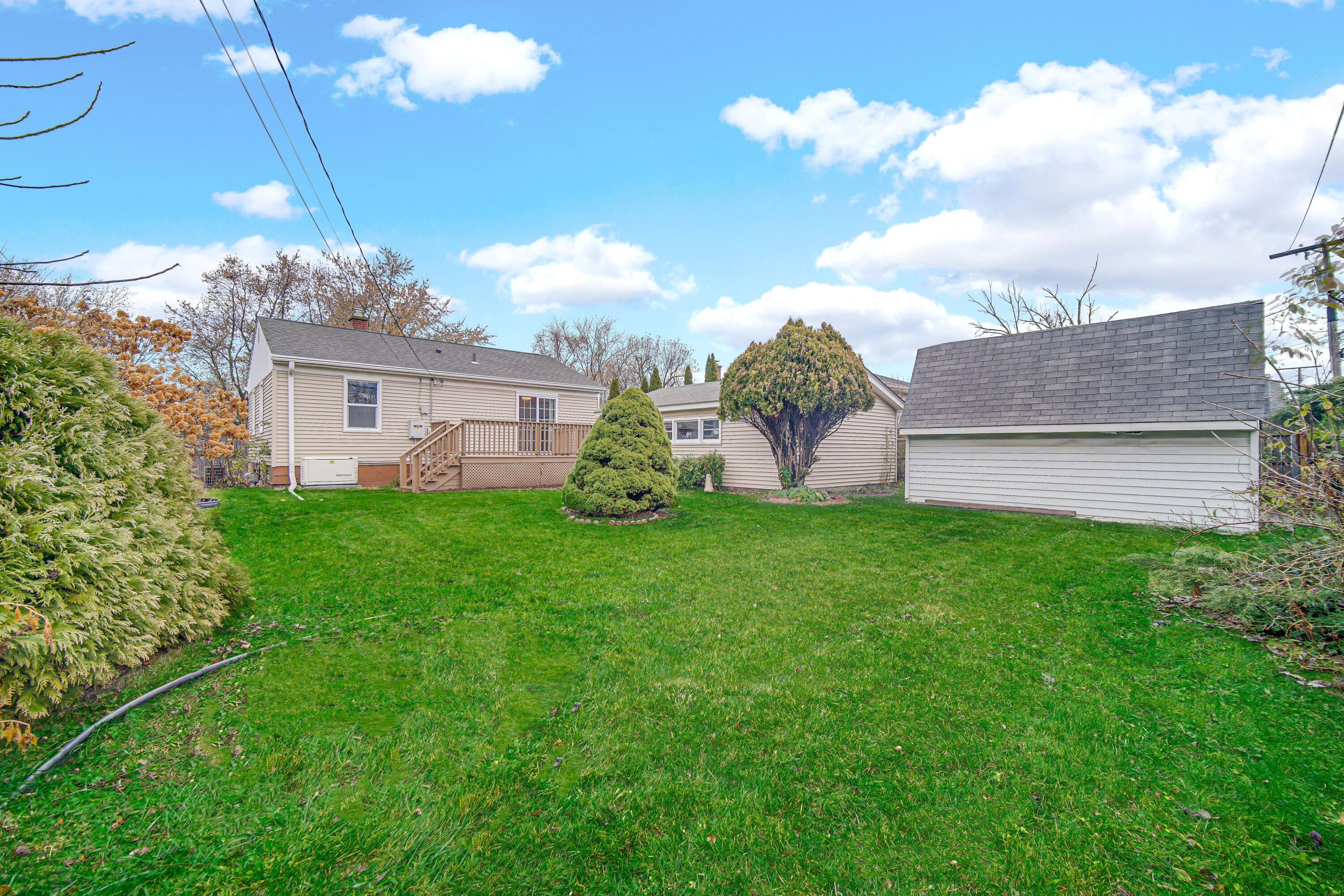 3302 Eder Street Highland, IN 46322 - Photo 18 of 19 a view of a house with a yard and a garden
