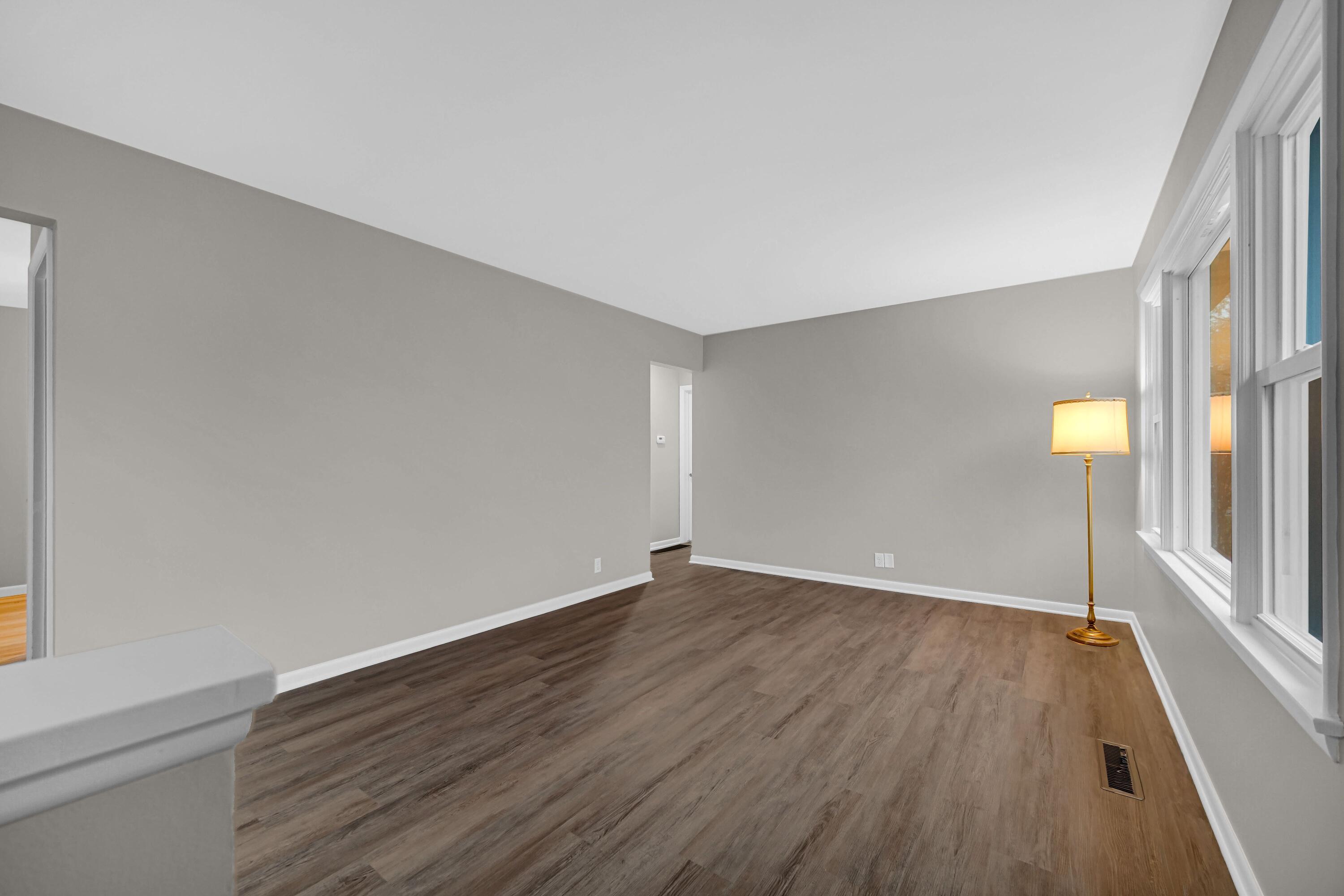 3302 Eder Street Highland, IN 46322 - Photo 3 of 19 an empty room with wooden floor and windows
