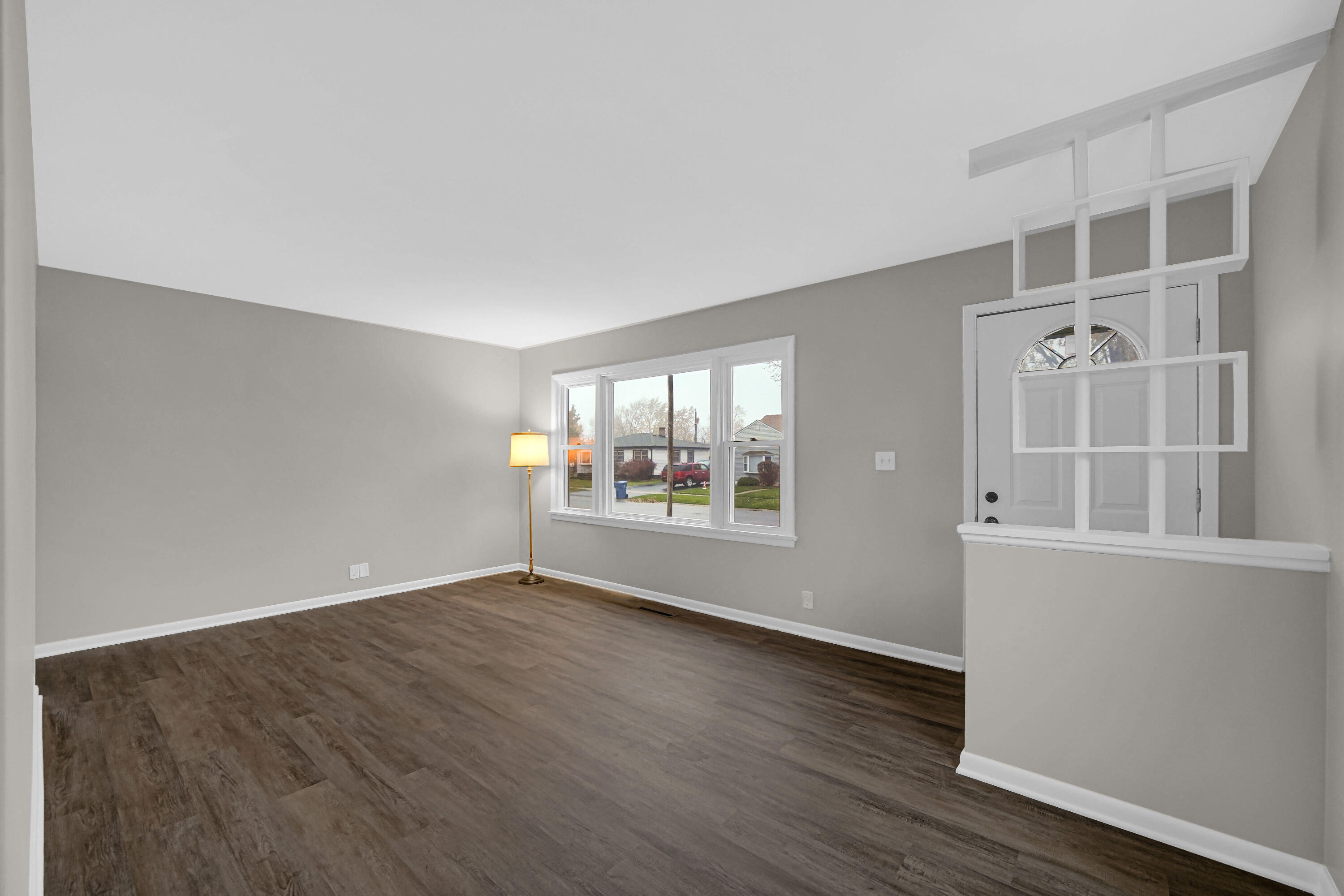 3302 Eder Street Highland, IN 46322 - Photo 4 of 19 an empty room with wooden floor and windows