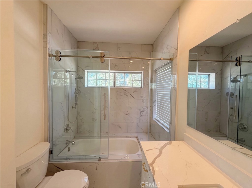 39850 Kapalua Way Temecula, CA 92592 - Photo 14 of 35 a bathroom with a sink and shower