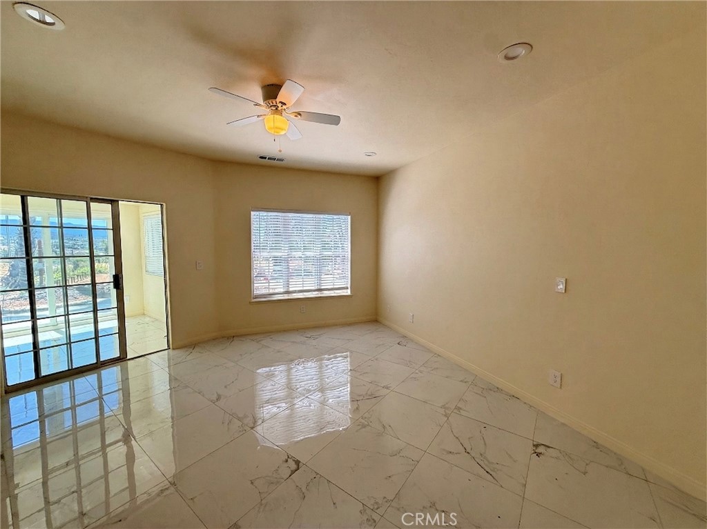 39850 Kapalua Way Temecula, CA 92592 - Photo 18 of 35 a view of an empty room with a window