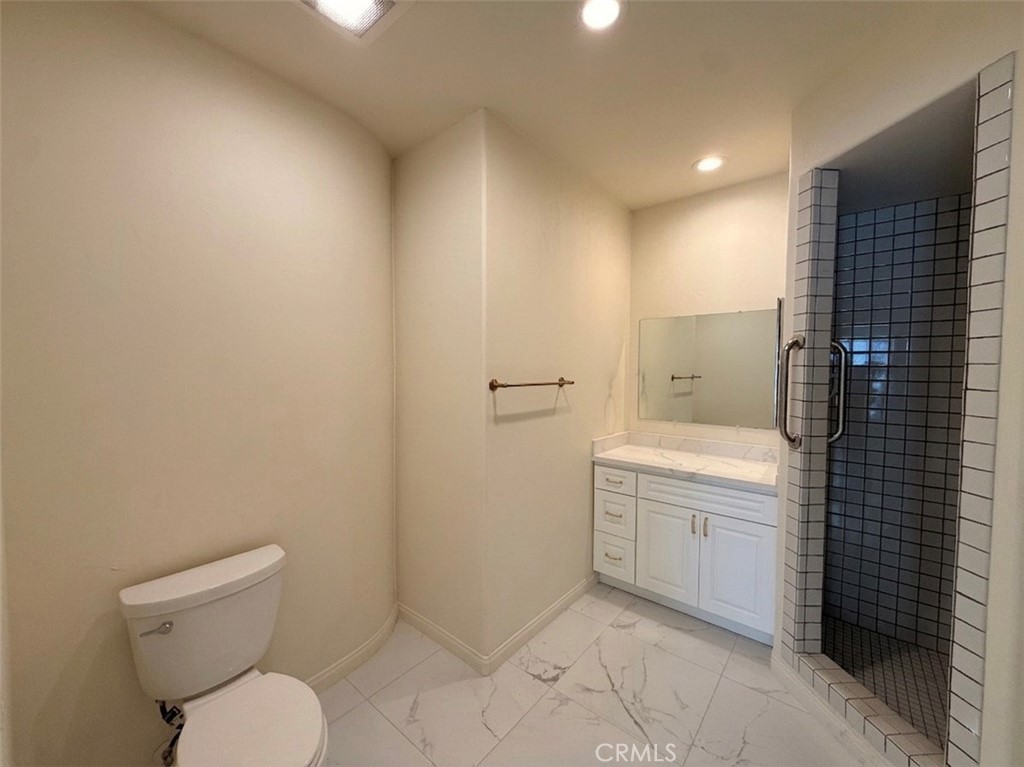 39850 Kapalua Way Temecula, CA 92592 - Photo 20 of 35 a bathroom with a granite countertop toilet and a sink