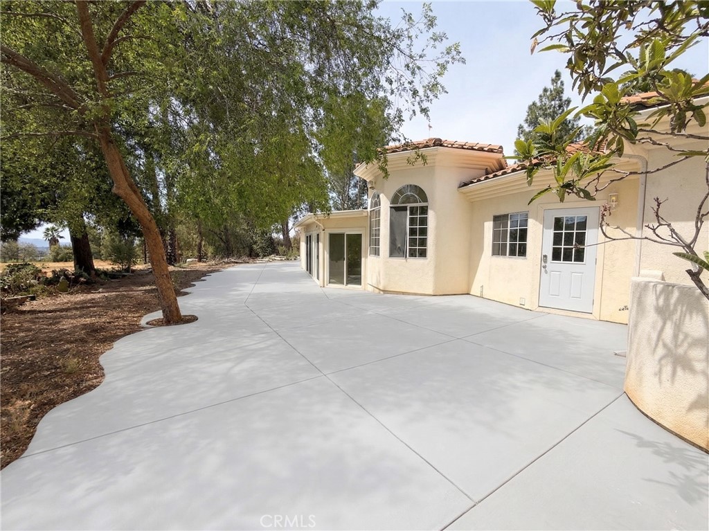 39850 Kapalua Way Temecula, CA 92592 - Photo 25 of 35 a view of a white house with a large tree
