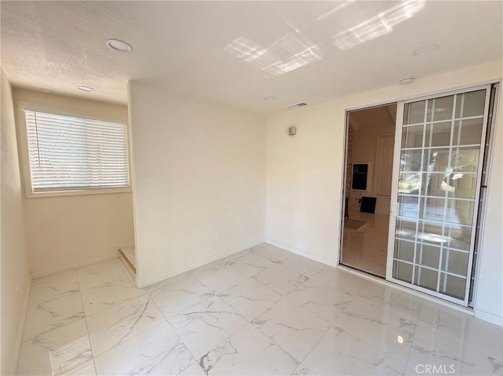 39850 Kapalua Way Temecula, CA 92592 - Photo 26 of 35 an empty room with windows