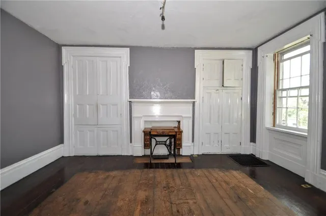 a view of livingroom with hardwood floor and a fireplace