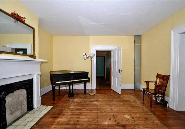 a view of a livingroom with furniture and a fireplace