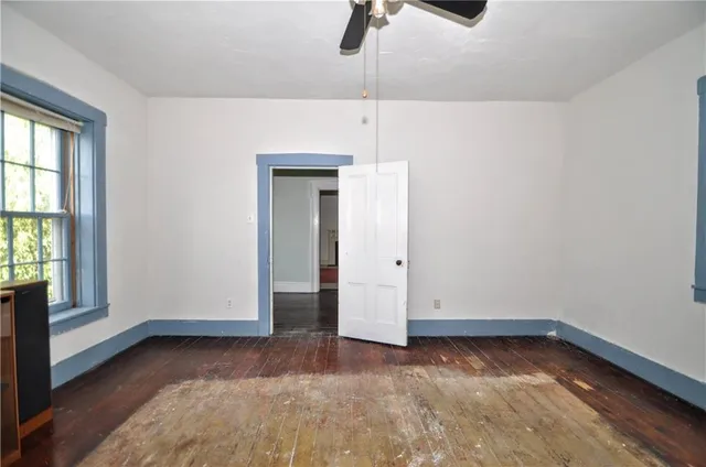 a view of an empty room with a window