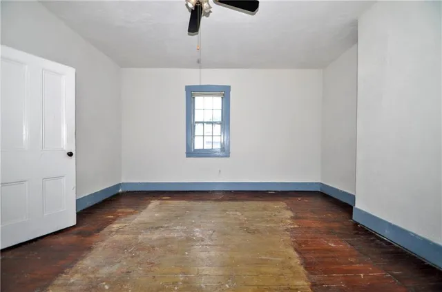 a view of a backyard with a table and chairs