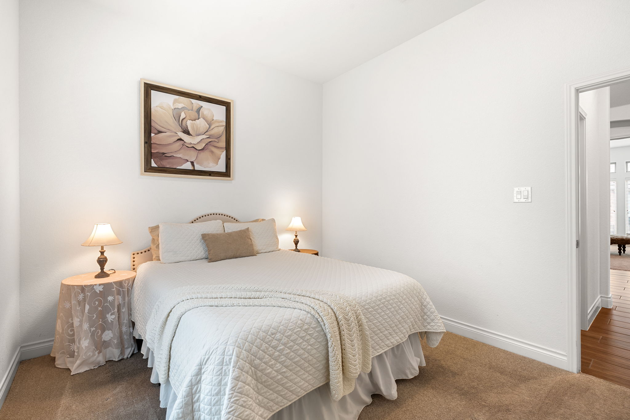 1908 Woolsey Way Leander, TX 78641 - Photo 16 of 36 Bedroom #2 is well-lit room offering plush carpeting and a convenient doorway to additional living areas.