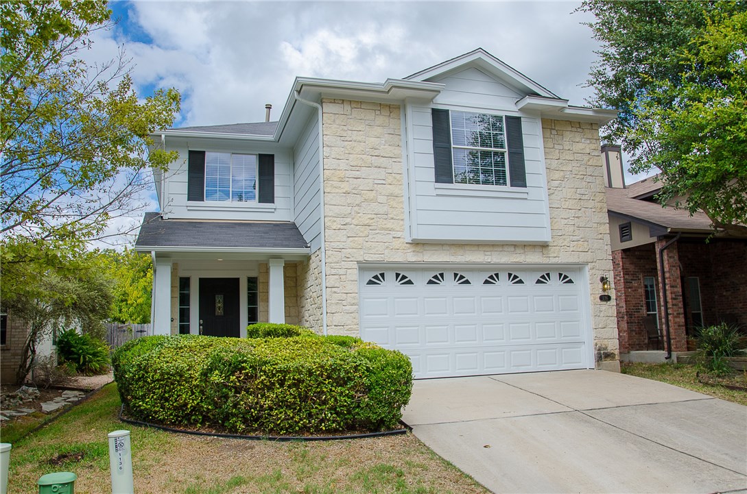 1136 Emmitt Run Austin, TX 78721 - Photo 1 of 1 a front view of a house with garden