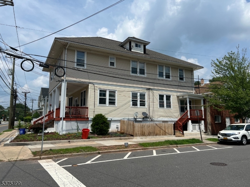 48 1st Avenue Raritan, NJ 08869 - Photo 2 of 10 a front view of a house with a yard
