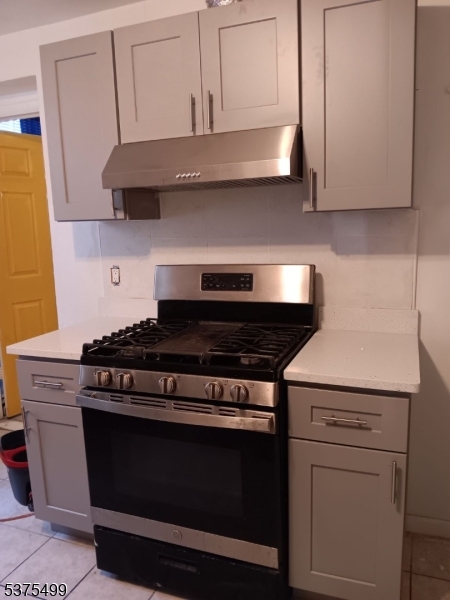 48 1st Avenue Raritan, NJ 08869 - Photo 6 of 10 a stove top oven sitting inside of a kitchen