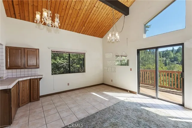 a kitchen with granite countertop a stove sink and cabinets