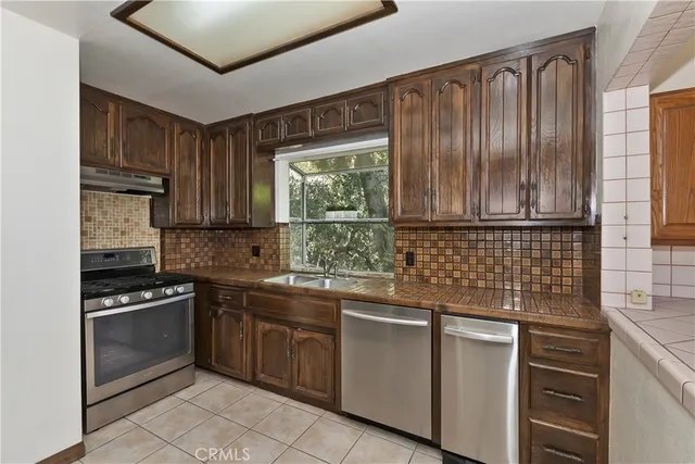 a kitchen that has a sink and a window