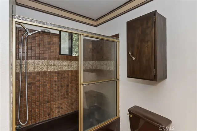 a view of an empty room with a fireplace