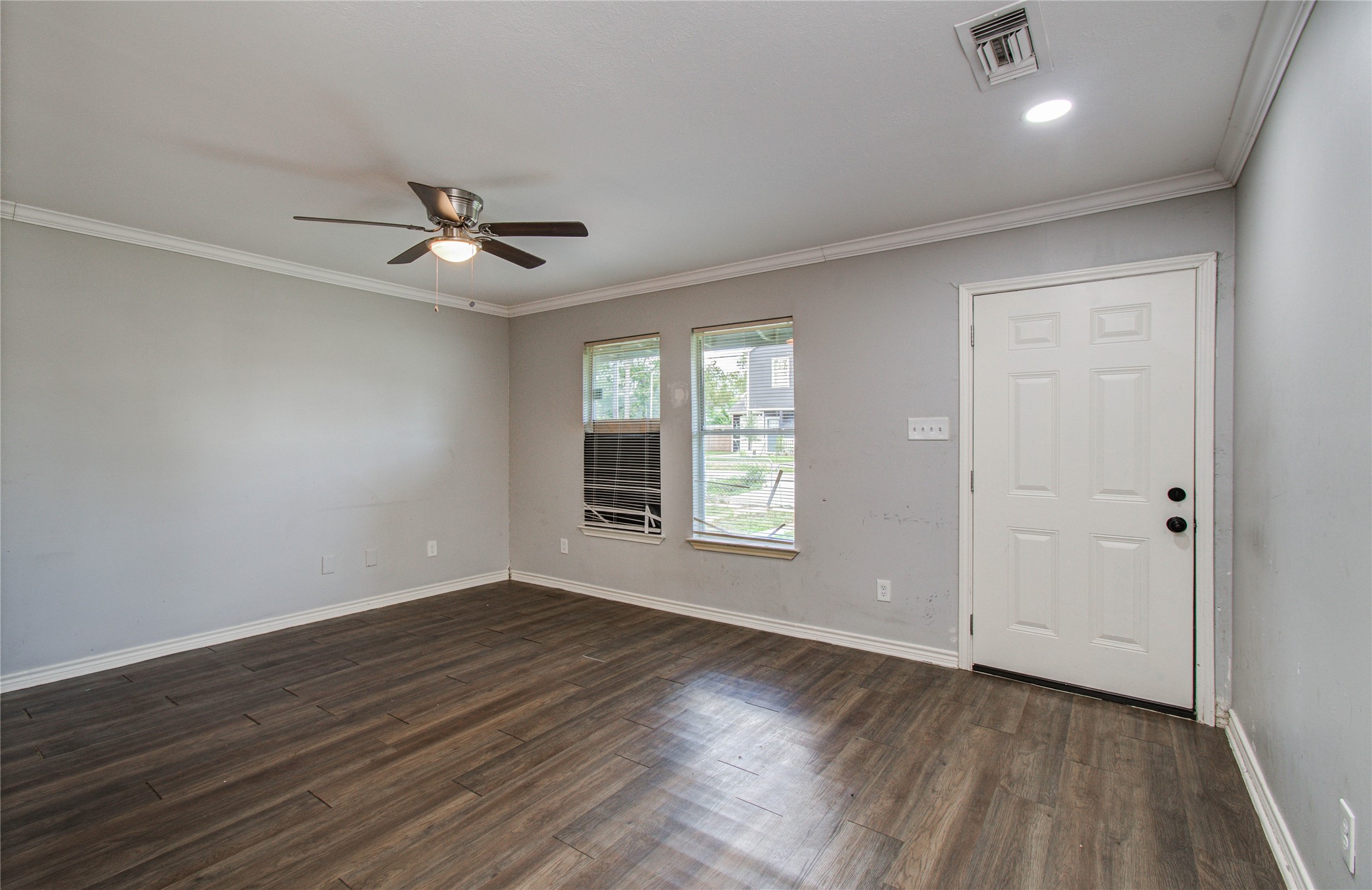 6830 New York Street Houston, TX 77021 - Photo 8 of 28 a view of empty room with wooden floor and fan