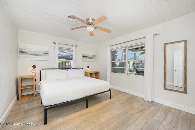 a bedroom with a bed and a table