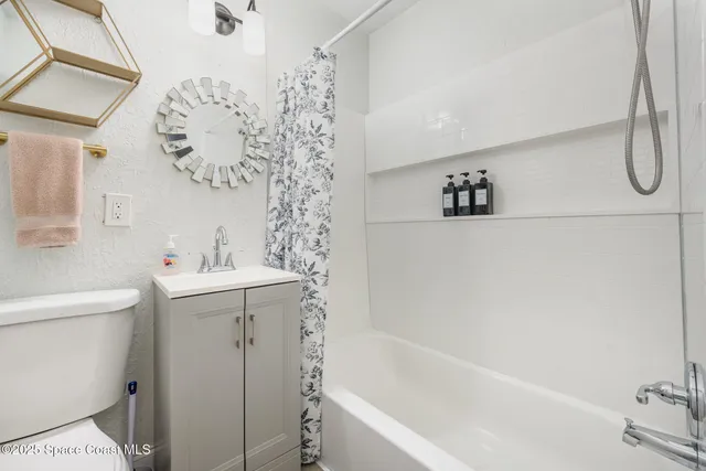 a bathroom with a sink a toilet and a bathtub