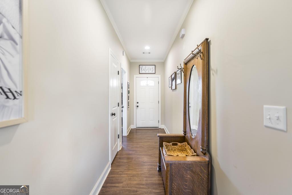 609 Live Oak Way Dublin, GA 31021 - Photo 8 of 37 a walk in closet with wooden floor