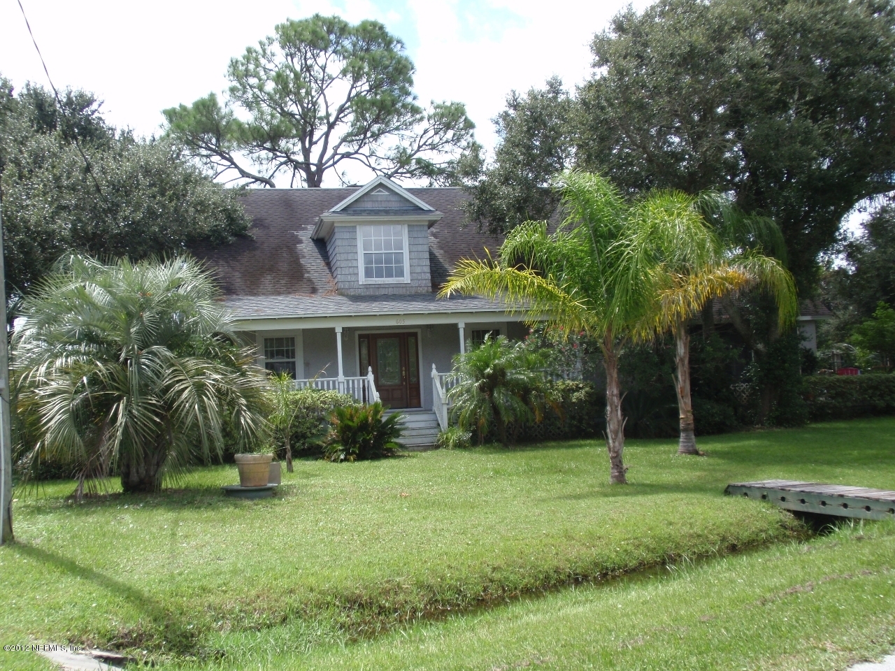 605 Twenty Third Street St. Augustine, FL 32084 - Photo 1 of 2 a front view of a house with a yard
