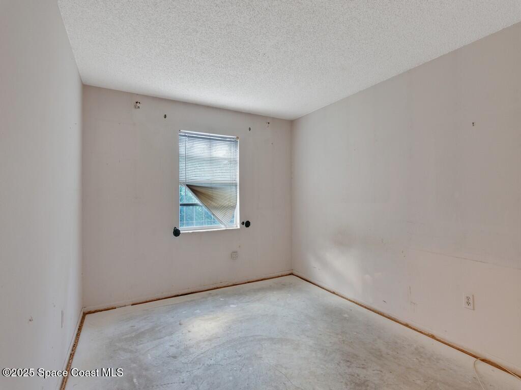 3170 Kent Drive Melbourne, FL 32935 - Photo 15 of 26 an empty room with a window