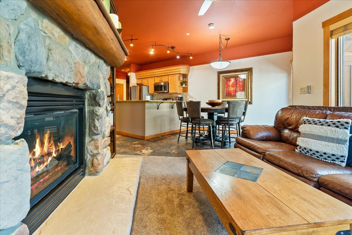 91 River Run Road, Unit 8111 Keystone, CO 80435 - Photo 15 of 43 a living room with furniture a flat screen tv and a fireplace