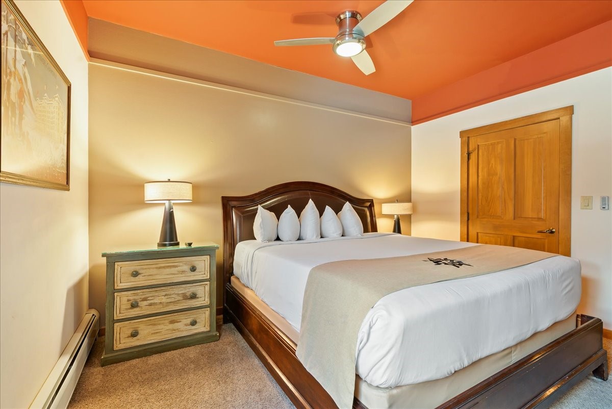 91 River Run Road, Unit 8111 Keystone, CO 80435 - Photo 21 of 43 a bedroom with a bed and a cabinets