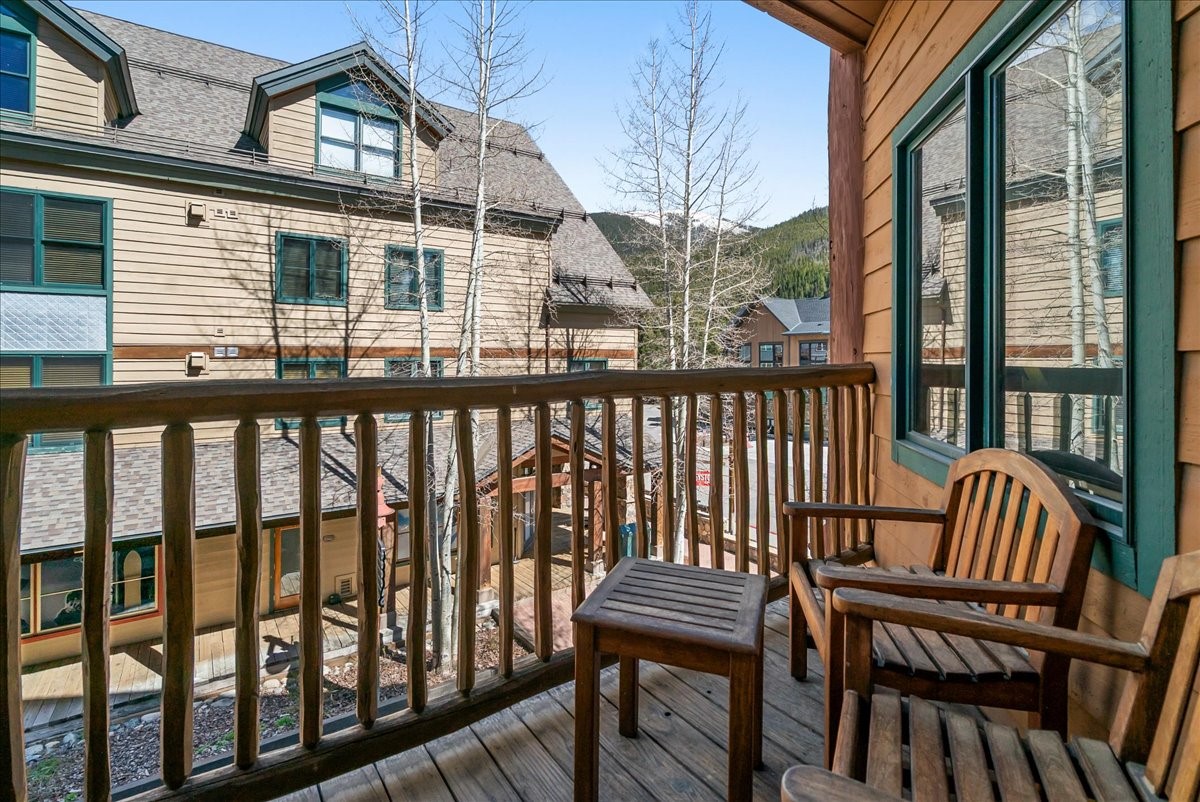 91 River Run Road, Unit 8111 Keystone, CO 80435 - Photo 24 of 43 a view of a chairs on wooden deck