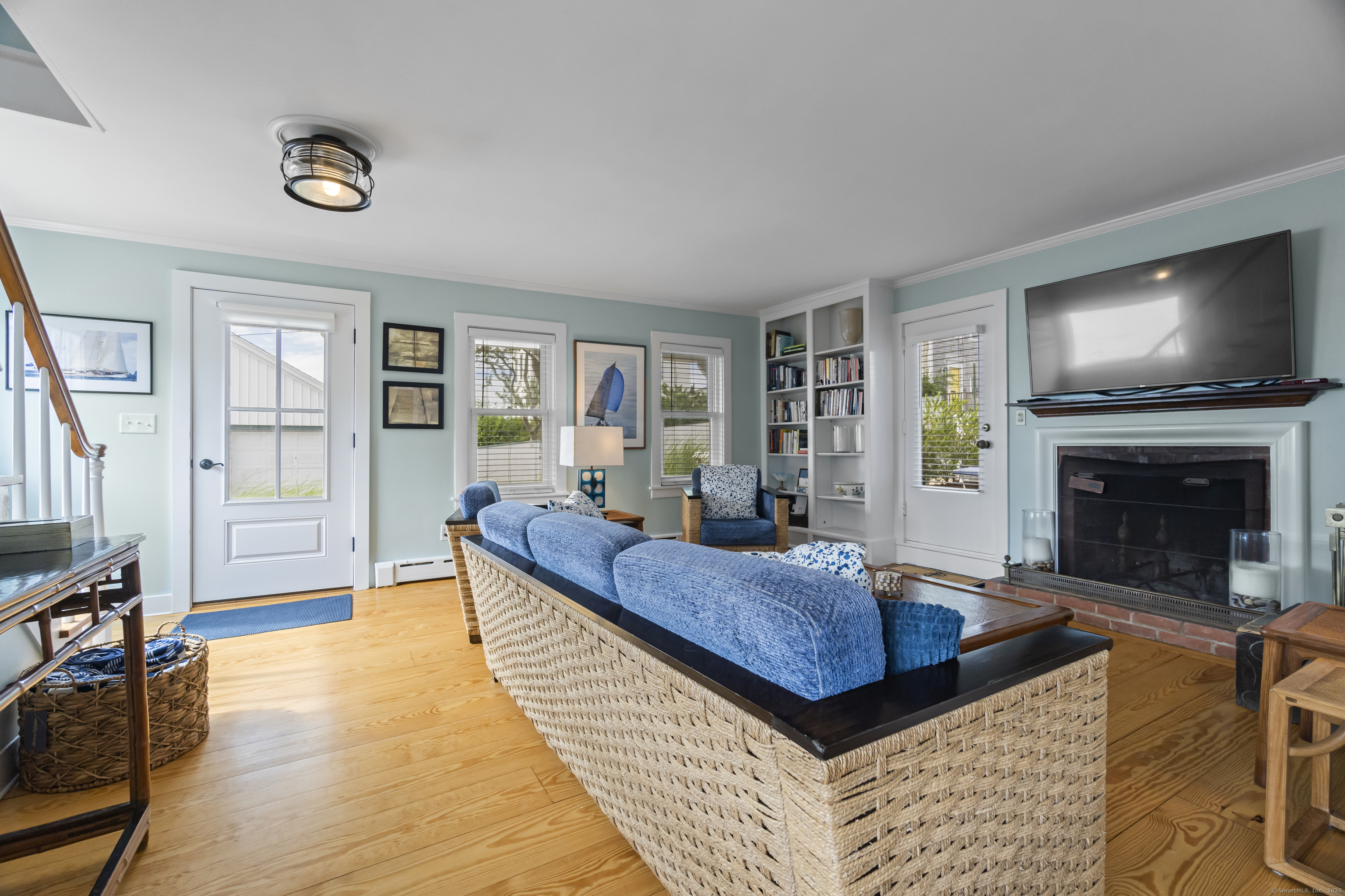 20 Omega Street Stonington, CT 06378 - Photo 28 of 37 a living room with furniture and a fireplace