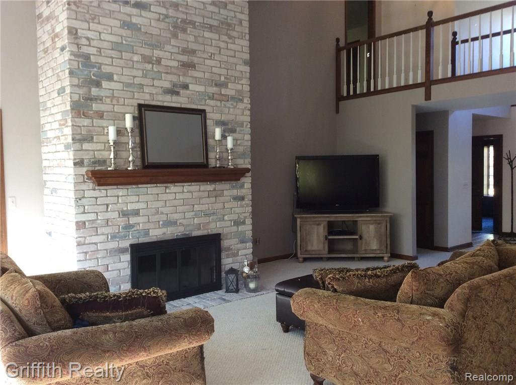 540 Timber Ridge Trail Howell, MI 48843 - Photo 5 of 60 2 story great room; light and bright for ease of furniture placement.