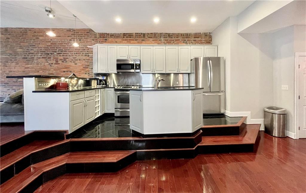 4413 Butler Street, Unit 3 Pittsburgh, PA 15201 - Photo 8 of 22 Open kitchen with bar seating- great for entertaining!