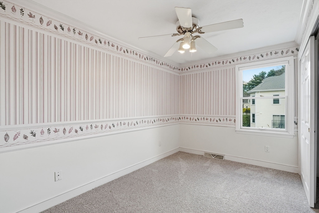 1032 Main Street, Unit 6 Millis, MA 02054 - Photo 18 of 42 a view of an empty room with a window