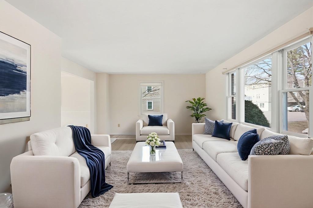 1032 Main Street, Unit 6 Millis, MA 02054 - Photo 2 of 42 a living room with furniture and a large window