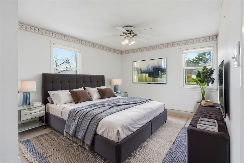1032 Main Street, Unit 6 Millis, MA 02054 - Photo 22 of 42 a bedroom with bed and a flat screen tv