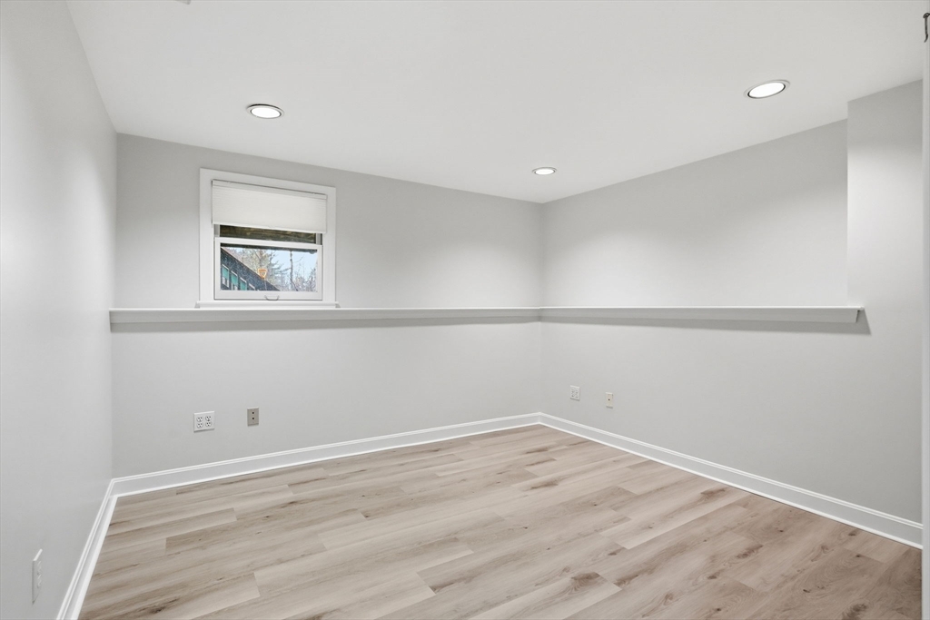 1032 Main Street, Unit 6 Millis, MA 02054 - Photo 28 of 42 a view of empty room with wooden floor and fan
