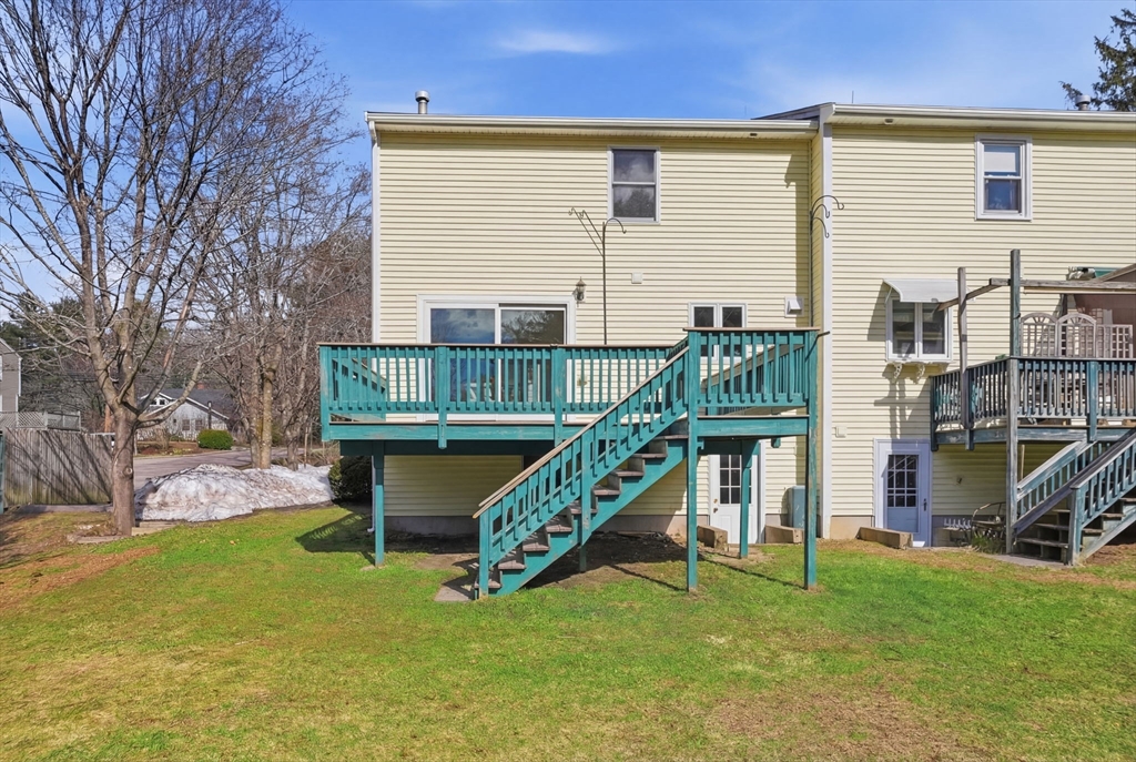 1032 Main Street, Unit 6 Millis, MA 02054 - Photo 33 of 42 a view of an house with backyard and deck