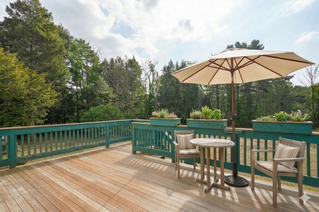 1032 Main Street, Unit 6 Millis, MA 02054 - Photo 34 of 42 a view of a deck with furniture