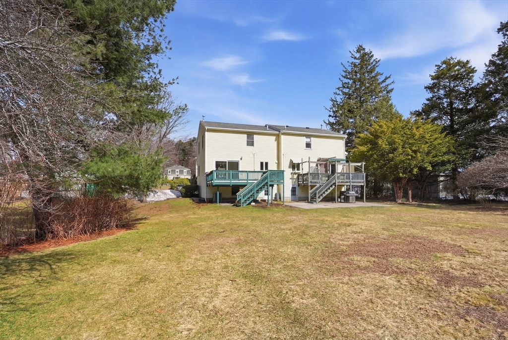 1032 Main Street, Unit 6 Millis, MA 02054 - Photo 35 of 42 a view of a house with a yard and garage