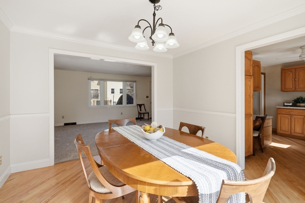 1032 Main Street, Unit 6 Millis, MA 02054 - Photo 9 of 42 a view of a dining room with furniture and wooden floor