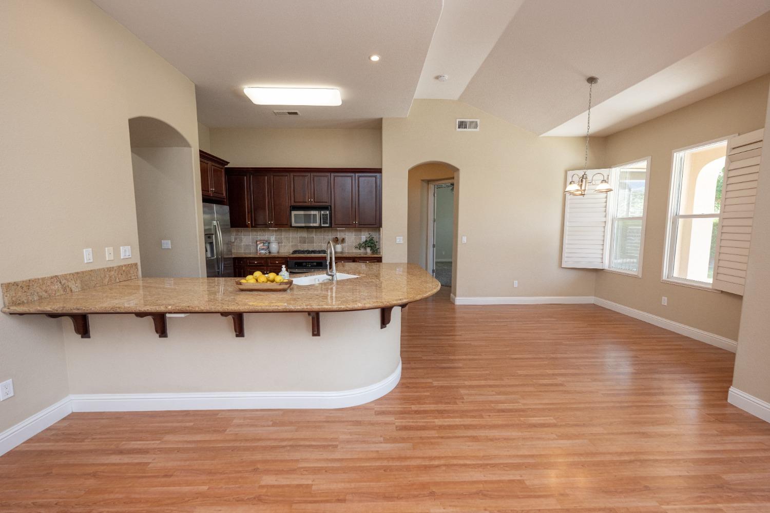 1778 Osmun Avenue Clovis, CA 93619 - Photo 12 of 35 a room with stainless steel appliances kitchen island sink refrigerator and window