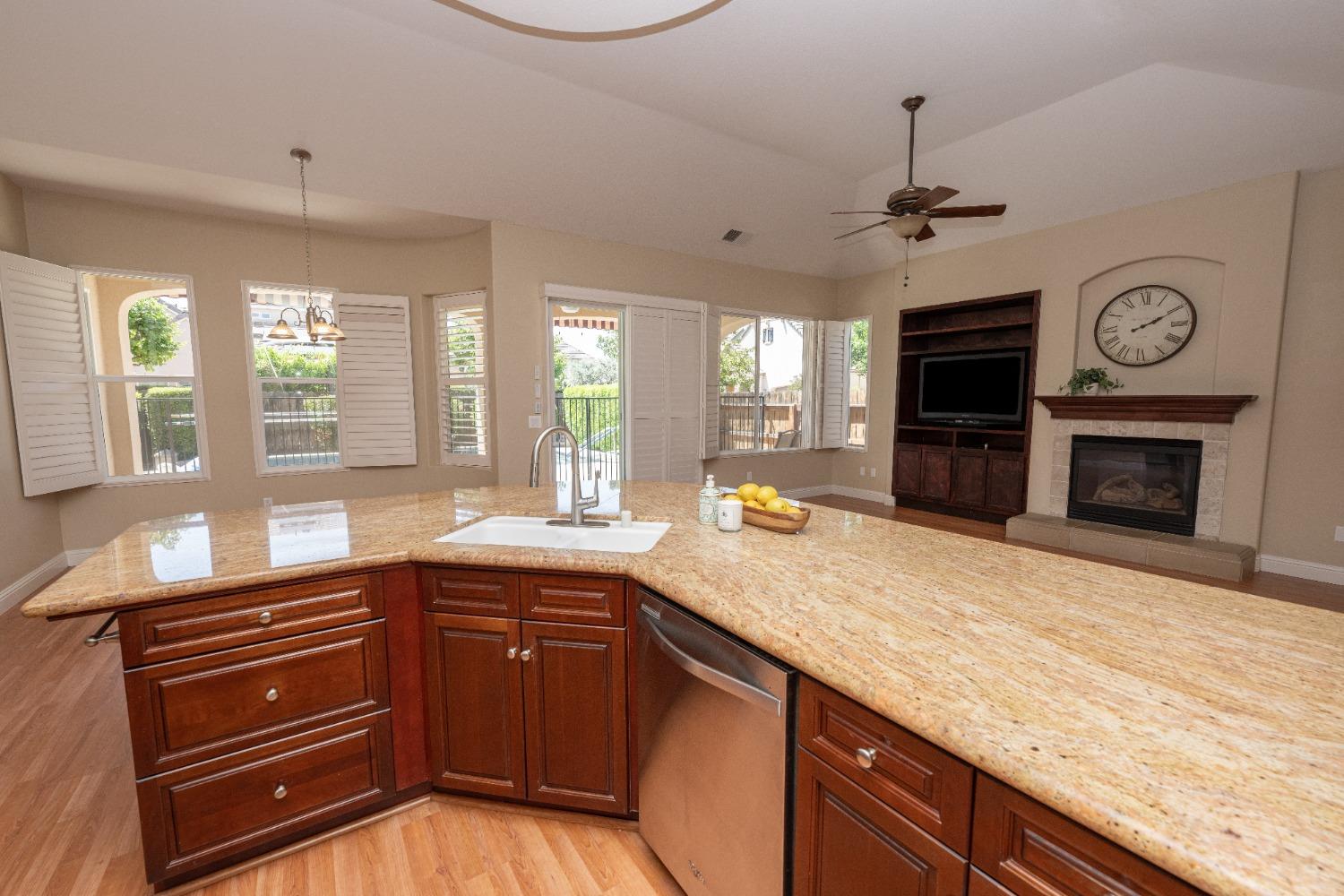 1778 Osmun Avenue Clovis, CA 93619 - Photo 16 of 35 a kitchen with a stove and a sink