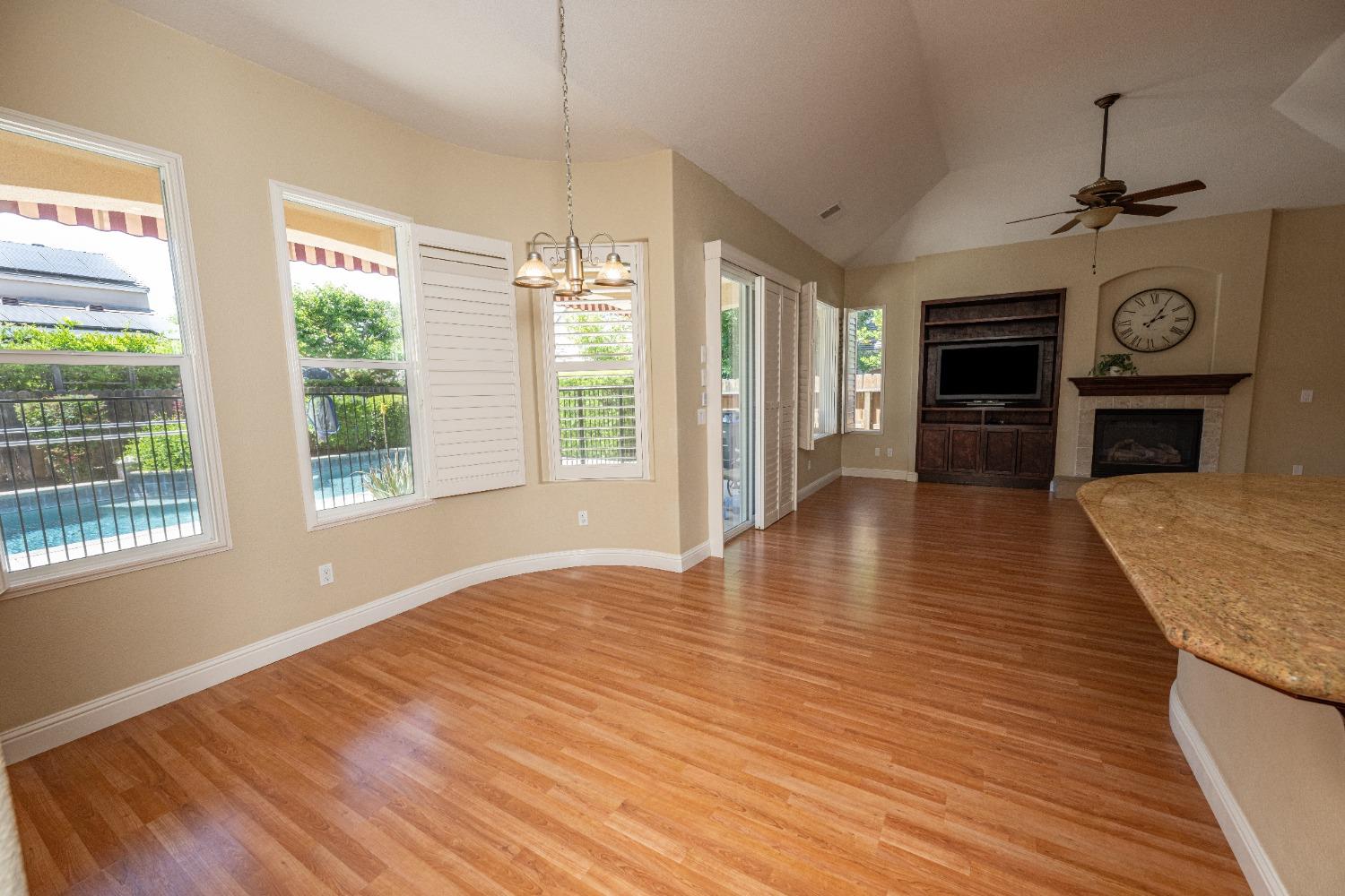 1778 Osmun Avenue Clovis, CA 93619 - Photo 18 of 35 a view of a livingroom with wooden floor fireplace and window