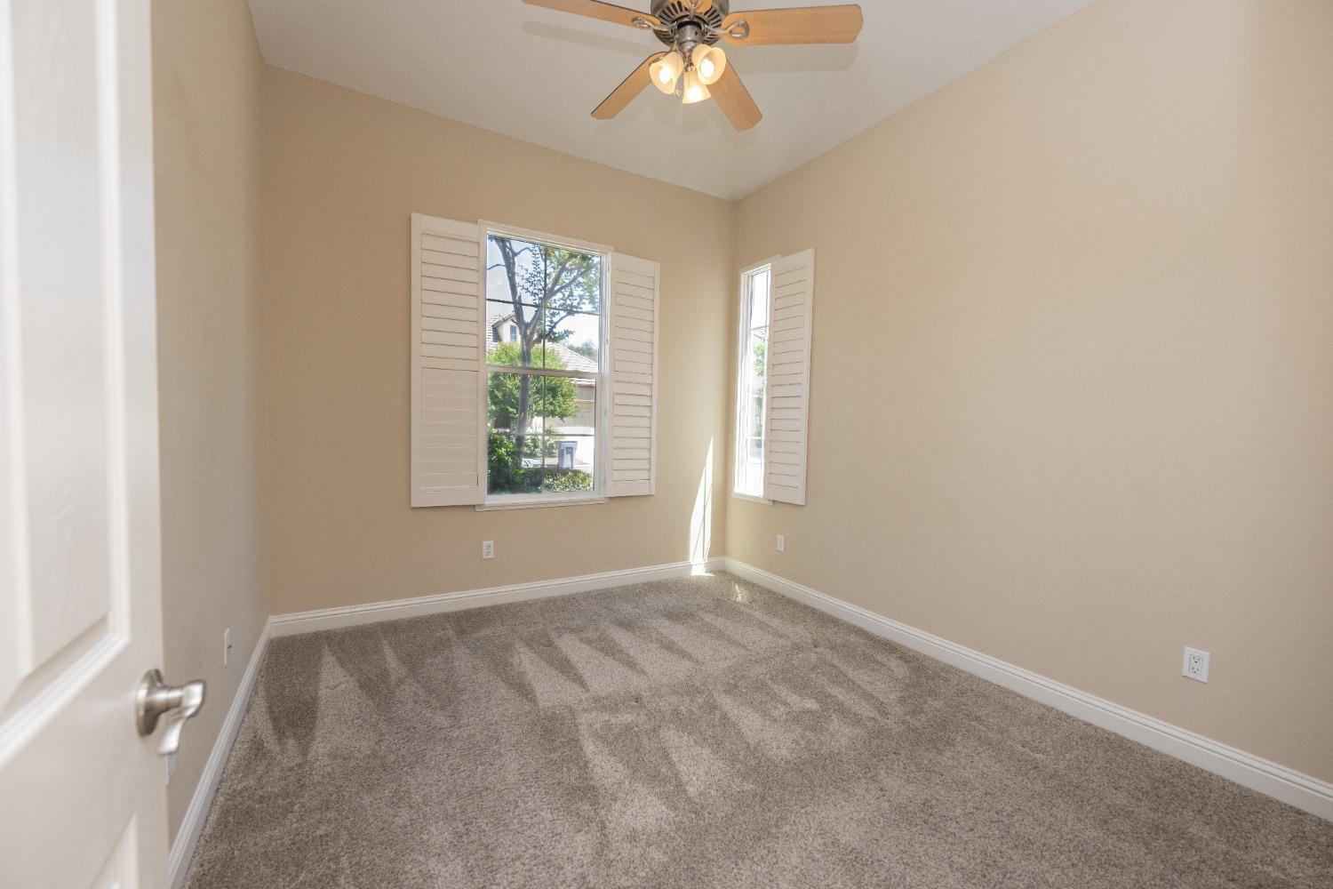 1778 Osmun Avenue Clovis, CA 93619 - Photo 19 of 35 an empty room with windows and fan